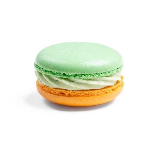 box of peach-matcha macarons